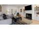 Cozy living room with a fireplace, built-in shelves, and comfortable seating at 907 Edgewood Ave Ne, Atlanta, GA 30307