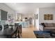 Open living space connects dining area to a modern kitchen with stainless steel appliances at 907 Edgewood Ave Ne, Atlanta, GA 30307