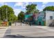 Whimsical street mural adds color to a vibrant neighborhood featuring trees and green spaces at 907 Edgewood Ave Ne, Atlanta, GA 30307