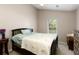 Comfortable bedroom features a neutral color palette, lots of natural light, and classic furnishings at 175 Prince Ct, Hiram, GA 30141