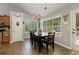 Dining area with backyard views, seating for four, and a modern light fixture at 175 Prince Ct, Hiram, GA 30141