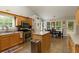 Well-lit kitchen features stainless steel appliances and center island overlooking an adjacent dining area at 175 Prince Ct, Hiram, GA 30141