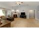Cozy living room with a brick fireplace, vaulted ceilings, and comfortable seating at 175 Prince Ct, Hiram, GA 30141