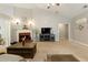 Bright living room with a fireplace, neutral carpet, and plenty of natural light at 175 Prince Ct, Hiram, GA 30141
