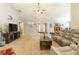 Bright living room with a fireplace, neutral carpet, and comfortable leather seating at 175 Prince Ct, Hiram, GA 30141