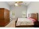 Comfortable bedroom with vaulted ceilings, neutral paint, and a large wooden armoire at 175 Prince Ct, Hiram, GA 30141