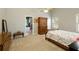 Bedroom with vaulted ceilings, neutral paint, and a connected bathroom offers a relaxing retreat at 175 Prince Ct, Hiram, GA 30141