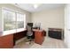 Bright home office with large windows, neutral paint, a sizable desk, and storage options at 175 Prince Ct, Hiram, GA 30141