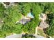 Aerial view showcasing the property's pool, landscaping, and proximity to lush greenery at 410 Glenmont Ct, Atlanta, GA 30350