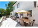 Charming outdoor dining space with table and cushioned chairs on a spacious porch at 410 Glenmont Ct, Atlanta, GA 30350