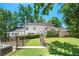 A backyard featuring a spacious lawn, patio, steps, and fence at 410 Glenmont Ct, Atlanta, GA 30350