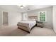 Bedroom featuring a bed, carpet, and access to a large walk-in closet at 410 Glenmont Ct, Atlanta, GA 30350