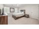 Bedroom featuring carpet, a bed with matching headboard and side table, and two windows with blinds at 410 Glenmont Ct, Atlanta, GA 30350