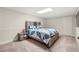 Bedroom showcasing a comfortable bed, soft carpet, and a clean, minimalist design at 410 Glenmont Ct, Atlanta, GA 30350