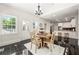 Bright breakfast nook features a large window and views of the backyard at 410 Glenmont Ct, Atlanta, GA 30350