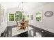 Bright breakfast nook features a large window and views of the backyard at 410 Glenmont Ct, Atlanta, GA 30350