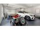 A well-kept garage showcasing luxury cars and ample space for storage or parking at 410 Glenmont Ct, Atlanta, GA 30350