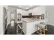 Modern kitchen features white cabinets, stainless steel appliances, and granite countertops at 410 Glenmont Ct, Atlanta, GA 30350