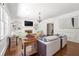 Bright living room showcasing hardwood floors, fireplace, built-in shelving, and elegant decor at 410 Glenmont Ct, Atlanta, GA 30350