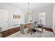 Bright office features hardwood floors, white trim, and modern furnishings at 410 Glenmont Ct, Atlanta, GA 30350