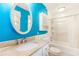 Bright bathroom with granite counters, oval mirror, and shower-over-tub combination at 701 Rosedale Se Dr, Smyrna, GA 30082