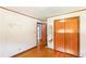 Bright bedroom with hardwood floors, closet, and nearby bathroom access at 701 Rosedale Se Dr, Smyrna, GA 30082