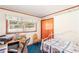 Comfortable bedroom with an office space, carpet, and natural light at 701 Rosedale Se Dr, Smyrna, GA 30082