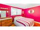 Bright bedroom with hardwood floors, two windows, and a cozy ambiance at 701 Rosedale Se Dr, Smyrna, GA 30082