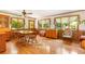 Bright dining room featuring hardwood floors, wood paneling, and large windows at 701 Rosedale Se Dr, Smyrna, GA 30082