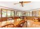 Sunlit dining room with hardwood floors, wood trim, and large windows with wooded views at 701 Rosedale Se Dr, Smyrna, GA 30082
