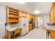 Spacious kitchen featuring wood cabinets, a small office nook, and tile flooring at 701 Rosedale Se Dr, Smyrna, GA 30082