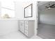 Well-lit bathroom vanity with sleek modern design, complemented by a large window at 816 Dodd S Trl # 172, Buford, GA 30518