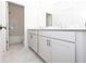 Bathroom boasts double sinks with white cabinets, subway tile, and modern fixtures at 816 Dodd S Trl # 172, Buford, GA 30518