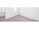 Bedroom displaying neutral carpet, white walls, and window providing natural light at 816 Dodd S Trl # 172, Buford, GA 30518