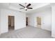Spacious bedroom with plush carpet and neutral tones, connecting to bathroom and walk-in closet at 816 Dodd S Trl # 172, Buford, GA 30518