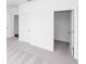 Bedroom showcasing plush carpet, white walls, and closet with open door at 816 Dodd S Trl # 172, Buford, GA 30518