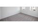 Bright bedroom featuring neutral carpet, two windows, and crisp white walls at 816 Dodd S Trl # 172, Buford, GA 30518