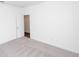Bedroom exhibiting neutral carpet, white walls, and doorway to another room at 816 Dodd S Trl # 172, Buford, GA 30518