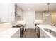 Bright kitchen features white cabinetry, stainless steel appliances, and a gas range at 816 Dodd S Trl # 172, Buford, GA 30518
