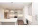 Bright, open kitchen featuring stainless appliances, white subway tile backsplash, and a large center island at 816 Dodd S Trl # 172, Buford, GA 30518
