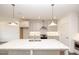 Contemporary kitchen design with stainless steel appliances, pendant lights, and stone countertops at 816 Dodd S Trl # 172, Buford, GA 30518