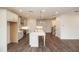 Open-concept kitchen with a large island, gas range, stainless hood, and white cabinets at 816 Dodd S Trl # 172, Buford, GA 30518