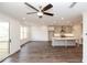 Open-concept floor plan with a modern kitchen, living area, and access to an outdoor deck at 816 Dodd S Trl # 172, Buford, GA 30518
