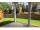Inviting outdoor patio with a manicured lawn, perfect for relaxation and entertaining at 816 Dodd S Trl # 172, Buford, GA 30518