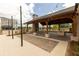 Covered outdoor pavilion with fireplace, seating, and grilling area at 816 Dodd S Trl # 172, Buford, GA 30518