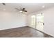 A bright, spacious room with a ceiling fan opens to an outdoor deck through sliding glass doors at 816 Dodd S Trl # 172, Buford, GA 30518