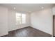 A well-lit room with a large window offers ample natural light and neutral tones at 816 Dodd S Trl # 172, Buford, GA 30518
