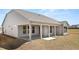 Covered back porch featuring concrete flooring and white support columns at 1619 Tielman Way, Snellville, GA 30078