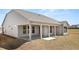 New construction home featuring a covered patio and a spacious, unfinished backyard at 1619 Tielman Way, Snellville, GA 30078