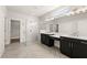 Modern bathroom featuring dual vanities, a glass shower, and contemporary fixtures at 1619 Tielman Way, Snellville, GA 30078